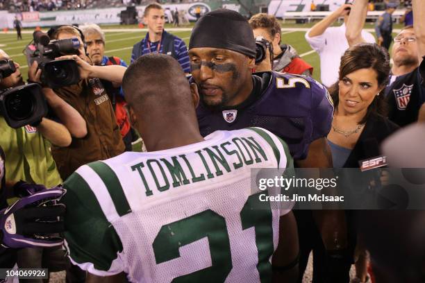 Ray Lewis of the Baltimore Ravens talks to LaDainian Tomlinson of the New York Jets after defeating the New York Jets in their home opener at the New...