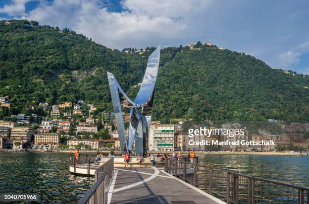 stainless steel sculpture 'life electric' by daniel libeskind to celebrate scientist alessandro volta at the verge end of diga foreanea pier, lake como, lombardy, italy - steel pier stock pictures, royalty-free photos & images