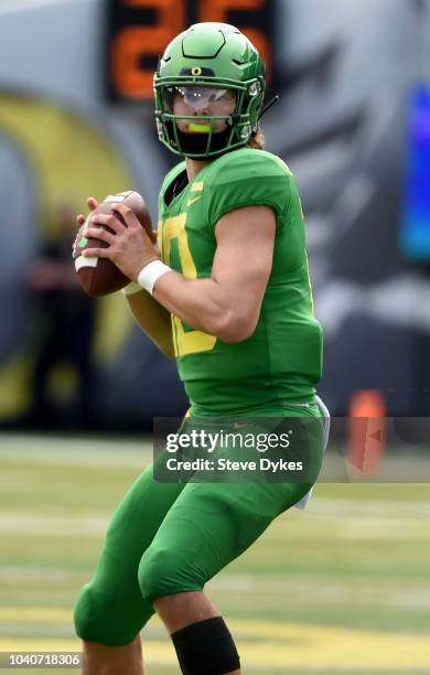 Justin Herbert of the Oregon Ducks gets set to pass the ball during the first half of the game against the Portland State Vikings at Autzen Stadium...