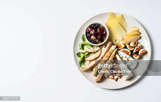 cheese platter - olive fruit stock pictures, royalty-free photos & images