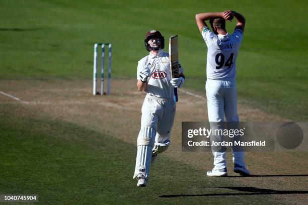 Ollie Pope of Surrey celebrates his century during day three of the Specsavers County Championship Division One match between Surrey and Essex at The...