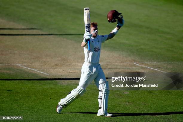 Ollie Pope of Surrey celebrates his century during day three of the Specsavers County Championship Division One match between Surrey and Essex at The...