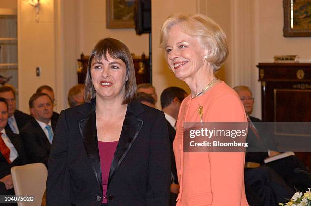 Nicola Roxon, Australia's minister of health and ageing, left, is sworn in by Quentin Bryce, Australia's governor general, in Canberra, Australia, on...