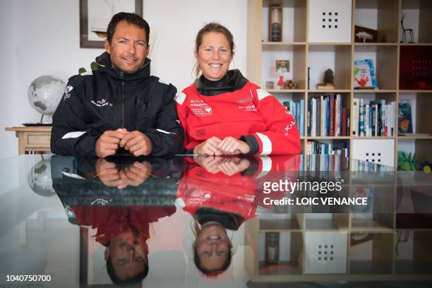 French skipper Romain Attanasio and his wife English skipper Samantha Davies pose in their house in Tregunc, western France, on September 25, 2018. -...