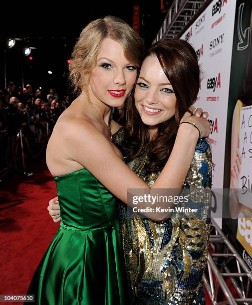 Singer/songwriter Taylor Swift and actress Emma Stone arrive at the premiere of Screen Gems' "Easy A" at the Chinese Theater on September 13, 2010 in...