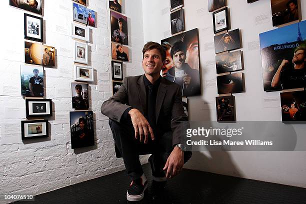 Australian TV and radio presenter, Andrew Gunsberg poses for a photograph at his exhibit '365-A Year of Self Portraits' at the Mart Gallery on...