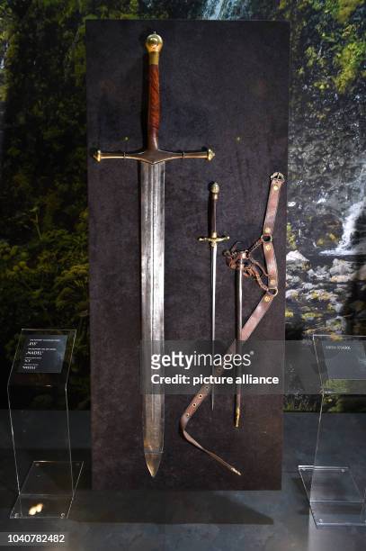 Two props from the US television show 'Game of Thrones', 'Sword of ice' and 'Sword of needle', are on display during the opening of the exhibition on...