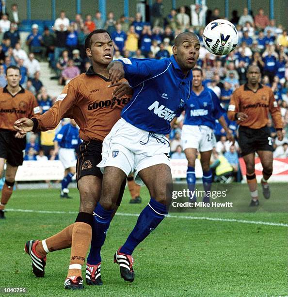 Marlon King of Gillingham is challenged by Joleon Lescott of Wolves during the Nationwide Division One match between Gillingham and Wolverhampton...