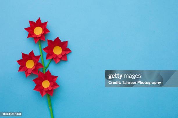origami flower with copy space - origami background stockfoto's en -beelden