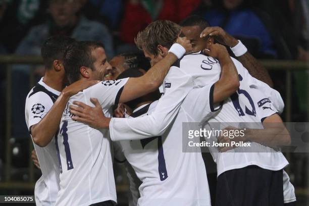 The team of Tottenham celebrates after Petri Pasanen of Bremen shot an owngoal during the UEFA Champions League group A match between SV Werder...