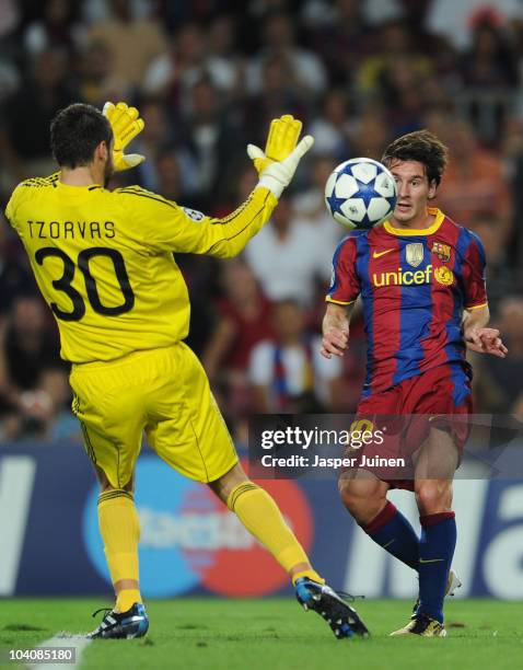 Lionel Messi of Barcelona scores his sides equalizing goal past goalkeeper Alexandros Tzorvas of Panathinaikos during the UEFA Champions League group...