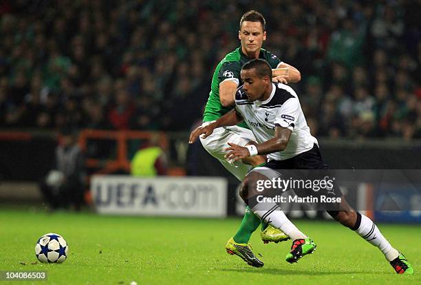 Marko Arnautovic of Bremen and Tom Huddlestone of Tottenham compete for the ball during the UEFA Champions League group A match between SV Werder...