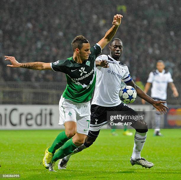 Werder Bremen's Austrian forward Marko Arnautovic and Tottenham's defender Ledley King vie for the ball during the UEFA Champions League group A...