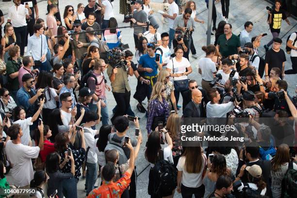 Chiara Ferragni and Valentina Ferragni enter the Alberta Ferretti show surrounded by photographers and fans during Milan Fashion Week Spring/Summer...