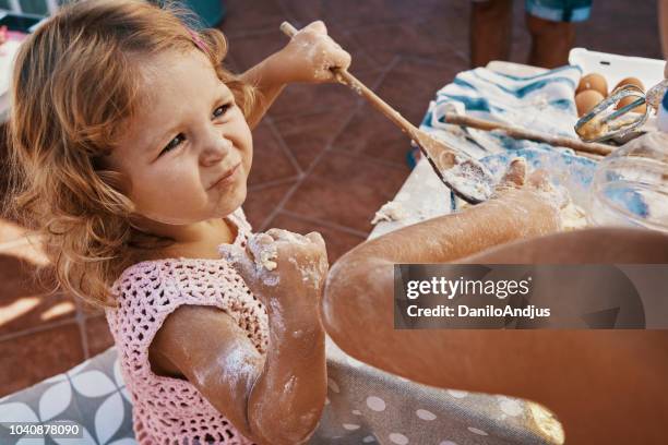 children having fun cooking together on the balcony - messy table stock pictures, royalty-free photos & images