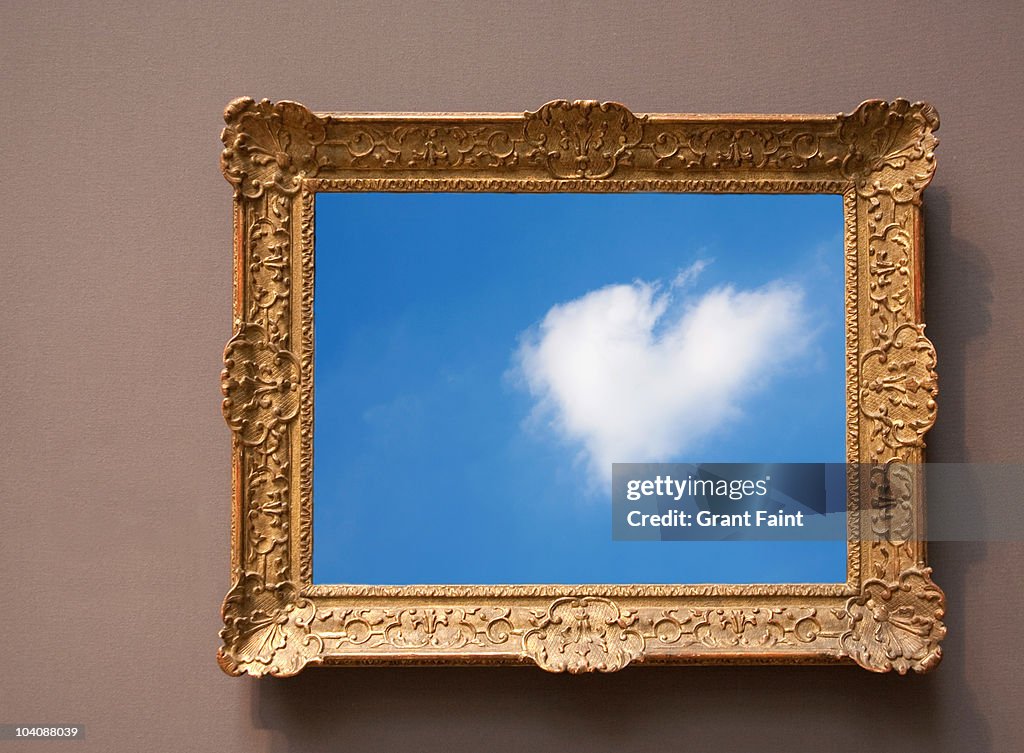 Heart shaped cloud photograph in frame