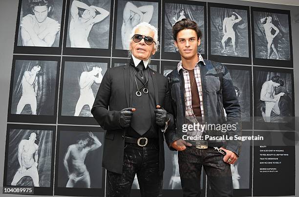 Designer Karl Lagerfeld poses with Baptiste Giabiconi as he attends the launch of his Exhibition at Maison Europeenne de la Photographie on September...