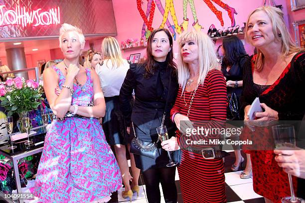 Designer Betsey Johnson speaks with guests during Mercedes-Benz Fashion Week at the Betsey Johnson store on September 14, 2010 in New York City.