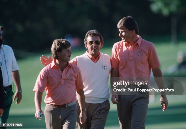 Ian Woosnam of Wales walks with captain Tony Jacklin and Nick Faldo of England during play for Team Europe against Team USA in the 1987 Ryder Cup at...