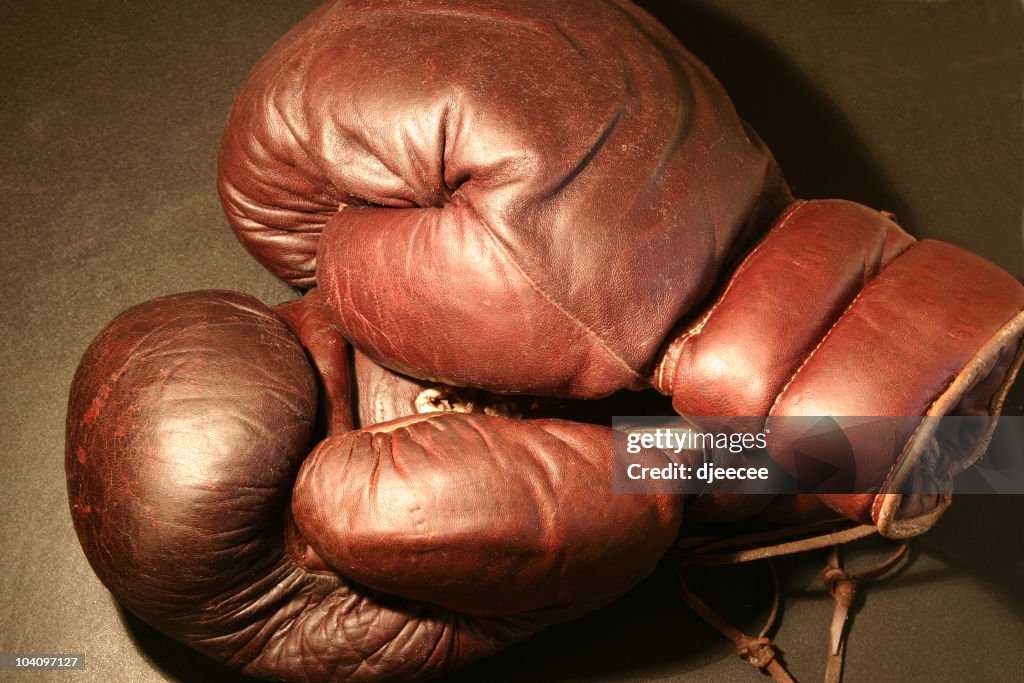 Old boxing gloves under light #1