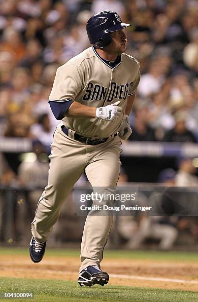 Matt Stairs of the San Diego Padres watches his two run pinch hit home run off of Rafael Betancourt of the Colorado Rockies in the eighth inning at...