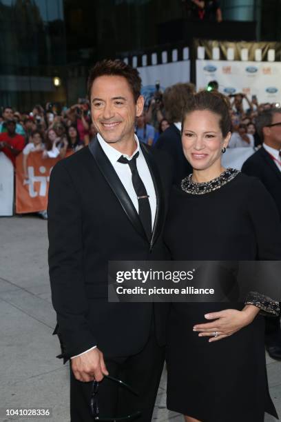 Actor and cast member Robert Downey Jr. And his wife, US producer Susan Downey, attend the premiere of the movie 'The Judge' during the 39th annual...