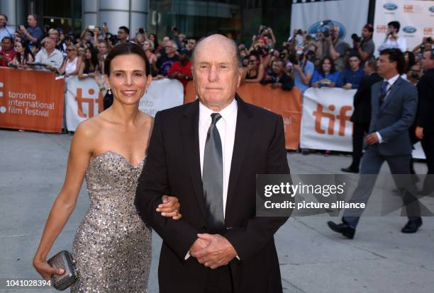 Actor and cast member Robert Duvall and his wife Luciana Pedraza attend the premiere of the movie 'The Judge' during the 39th annual Toronto...