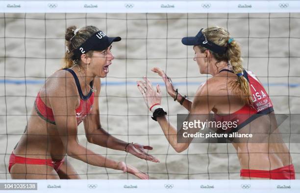 Kerri Walsh Jennings and April Ross of the USA celebrate during the Women's Beach Volleyball Bronze Medal Match between between Larissa / Talita of...