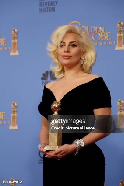 Lady Gaga holds the award for Best Performance by an Actress for a Limited Series in a Motion Picture made for Television for 'American Horror Story'...
