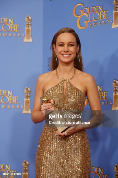 Actress Brie Larson holds the award for Best Actress in a Motion Picture, Drama for 'Room' in the press room during 73rd Annual Golden Globe Awards...