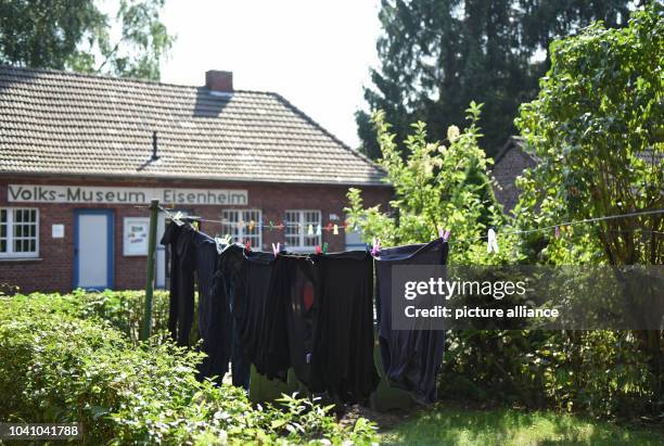 Laundry hangs on a clothesline in a garden in the workers' settlement in Eisenheim in Oberhausen, germany, 19 August 2016. Photo: Caroline Seidel/dpa...