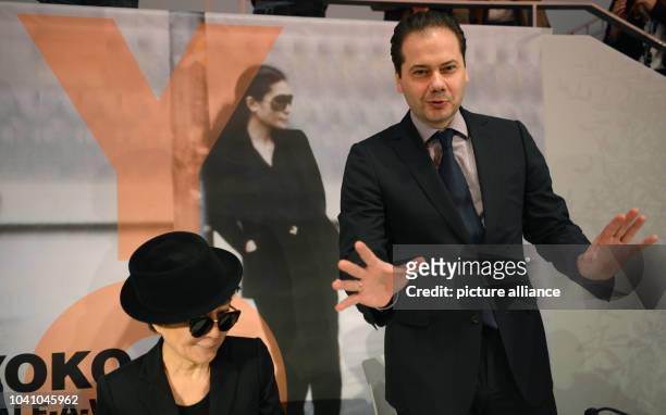 Lennon widow Yoko Ono poses next to Staedel Director Max Hollein during a press conference at the Schirn Kunsthalle in Frankfurt Main, Germany, 14...