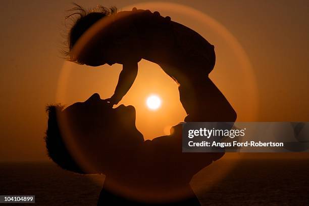 father and baby sunset - ford contour stock pictures, royalty-free photos & images