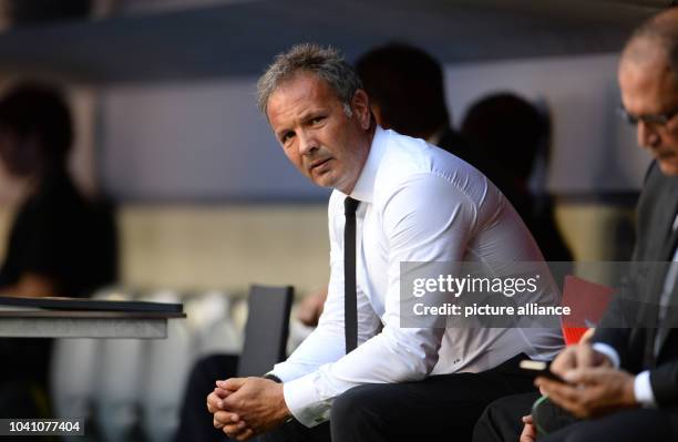 Milan's coach Sinisa Mihajlovic sits on the bench during the Audi Cup soccer friendly third-place play-off AC Milan vs Tottenham Hotspur in Munich,...