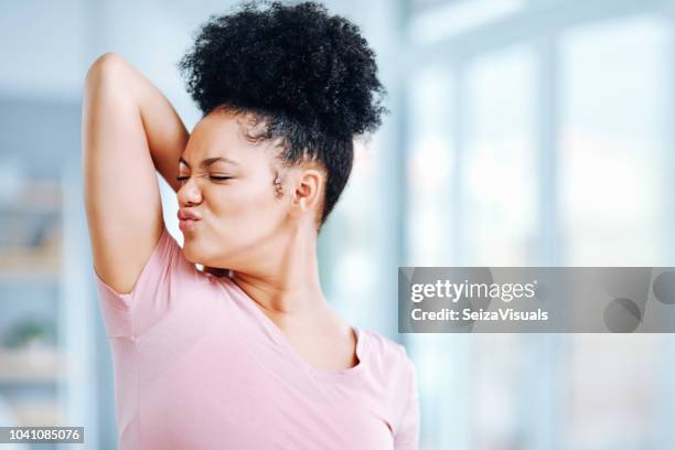 something smells... - smelling armpit stock pictures, royalty-free photos & images