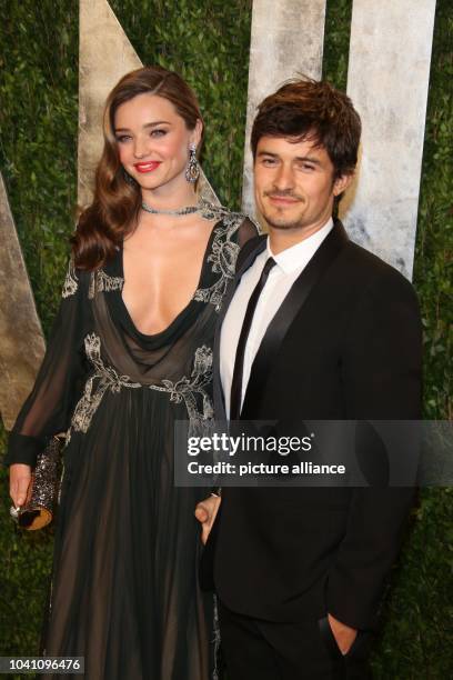 Model Miranda Kerr and actor Orlando Bloom arrive at the Vanity Fair Oscar Party at Sunset Tower in West Hollywood, Los Angeles, USA, on 24 February...