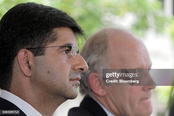 Rahul Dhir, chief executive officer of Cairn India Ltd., left, and Bill Gammell, chief executive officer of Cairn Energy Plc, attend a news...