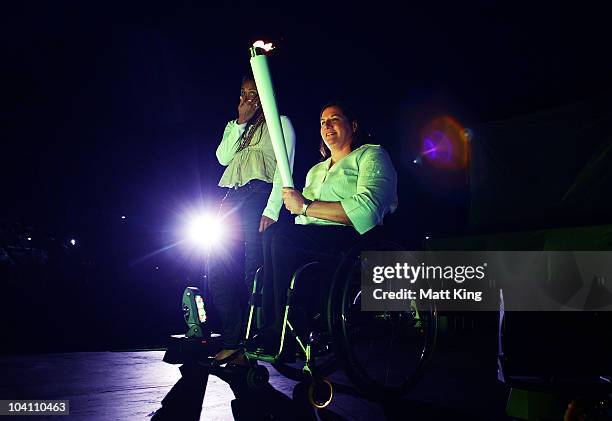 Sydney 2000 Olympic Games gold medallist Cathy Freeman and Sydney 2000 Paralympic Games gold medallist Louise Sauvage prepare to re-light the Olympic...