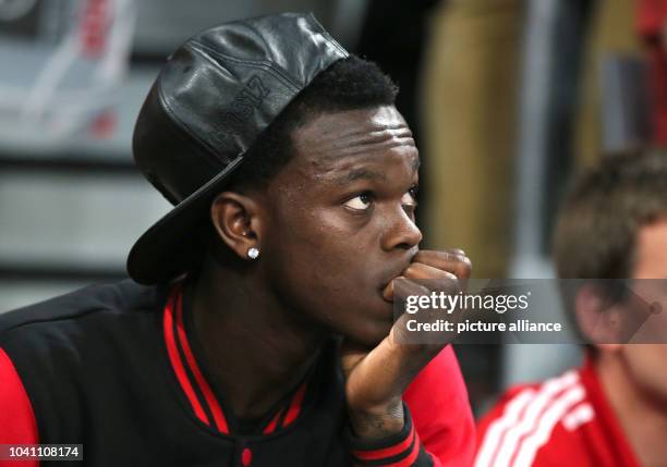 Player Dennis Schroeder of the Atlanta Hawks watches the German Bundesliga basketball playoff final between Brose Baskets Bamberg and Bayern Munich...