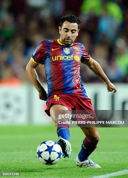 Barcelona's midfielder Xavi Hernandez controls the ball during the Champions League football match between Barcelona and Panathinaikos at Camp Nou...