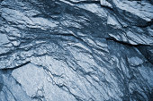Schist dark gray metamorphic rock background