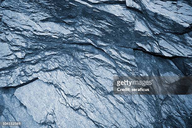 schist dark gray metamorphic rock background - graphite stock pictures, royalty-free photos & images