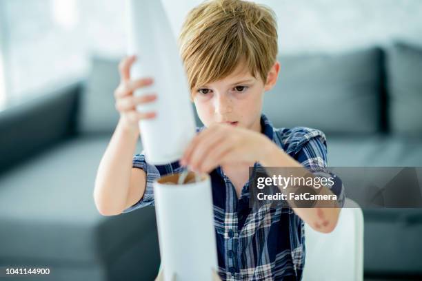 making a rocket - model rocket stock pictures, royalty-free photos & images