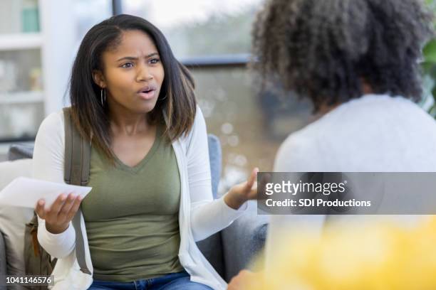 upset teen talks with therapist - students arguing stock pictures, royalty-free photos & images
