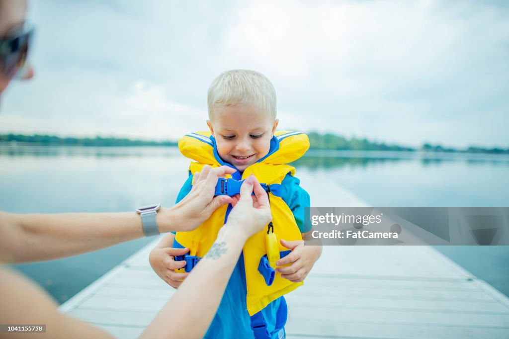 Helping Son With Life Jacket