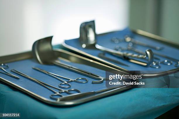 medical instruments on a tray in hospital - surgical tray stock pictures, royalty-free photos & images