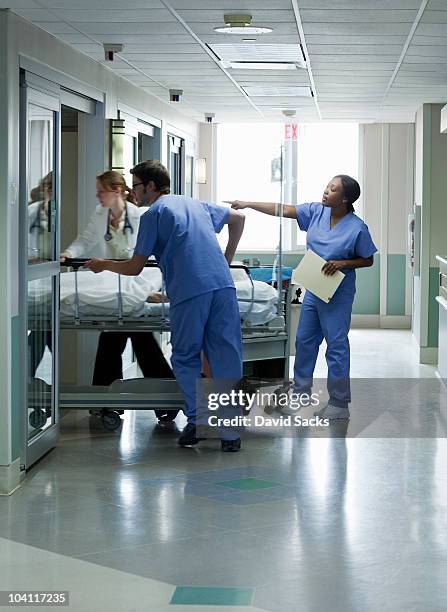 patient being transported to hospital room - medical ward stock pictures, royalty-free photos & images