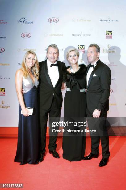 The president of the German soccer federation 'Deutsche Fussball-Bund Wolfgang Niersbach arrives with his wife Marion , goalkeeper coach Andreas...