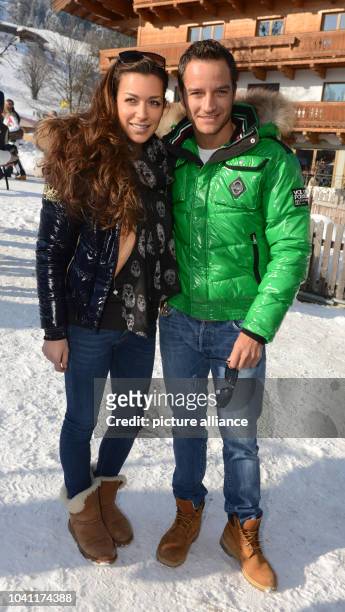 Race driver Timo Scheider and Jessica Hinterseer pose at the legendary Hahnenkamm Race in Kitzbuehel, Austria, 26 January 2013. This weekend...