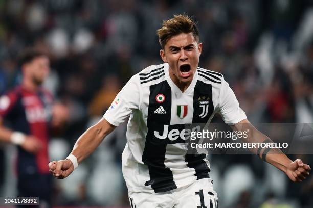Juventus' Argentinian forward Paulo Dybala celebrates after scoring a goal during the Italian Serie A football match between Juventus and Bologna on...